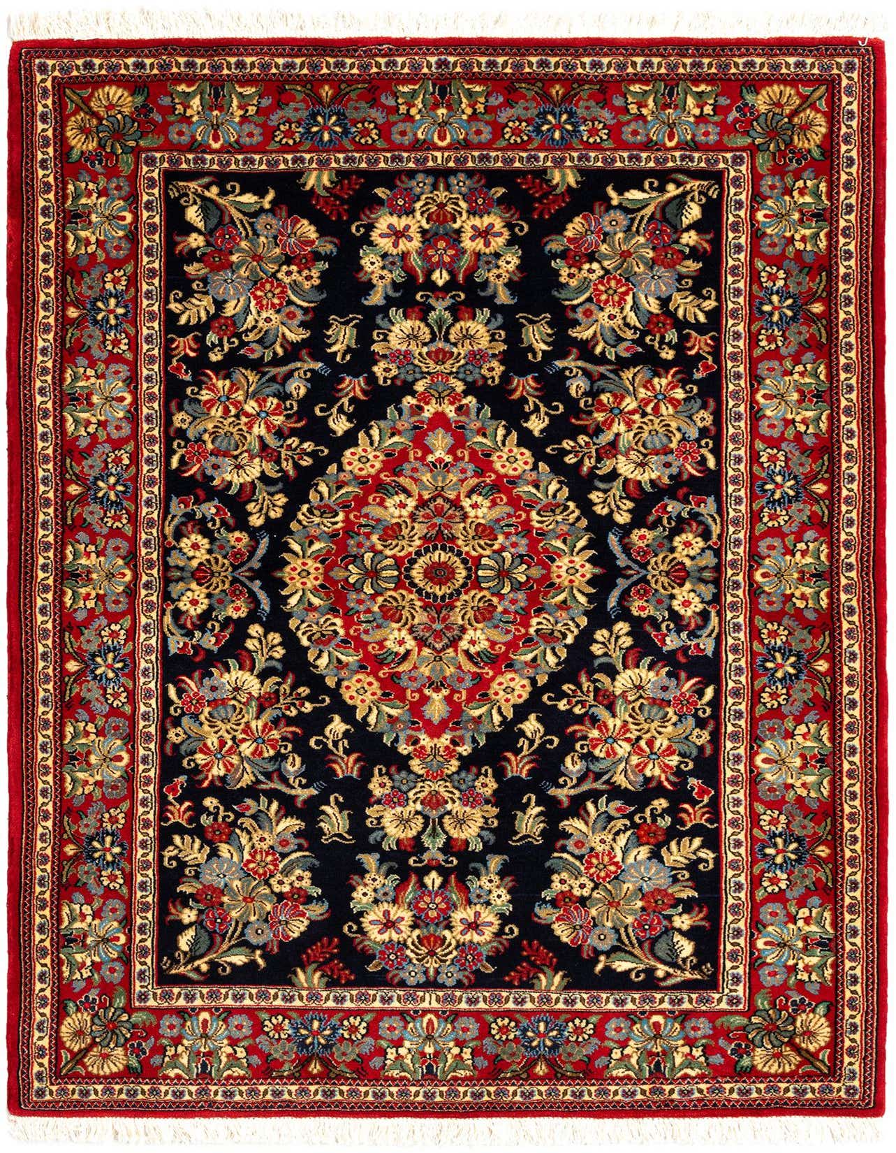 A rectangular 3x5 Persian Qom rug with a black field, red border, and intricate floral patterns in gold, blue, and red.