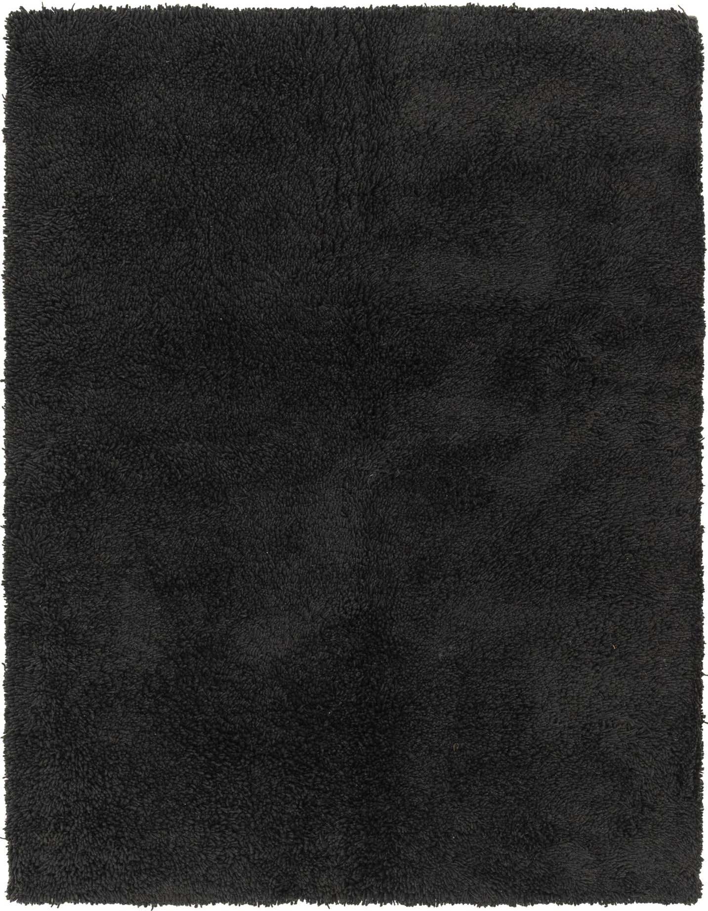 A soft, plush 6x9 rectangular shag rug in a deep blue color, ideal for a modern living room.