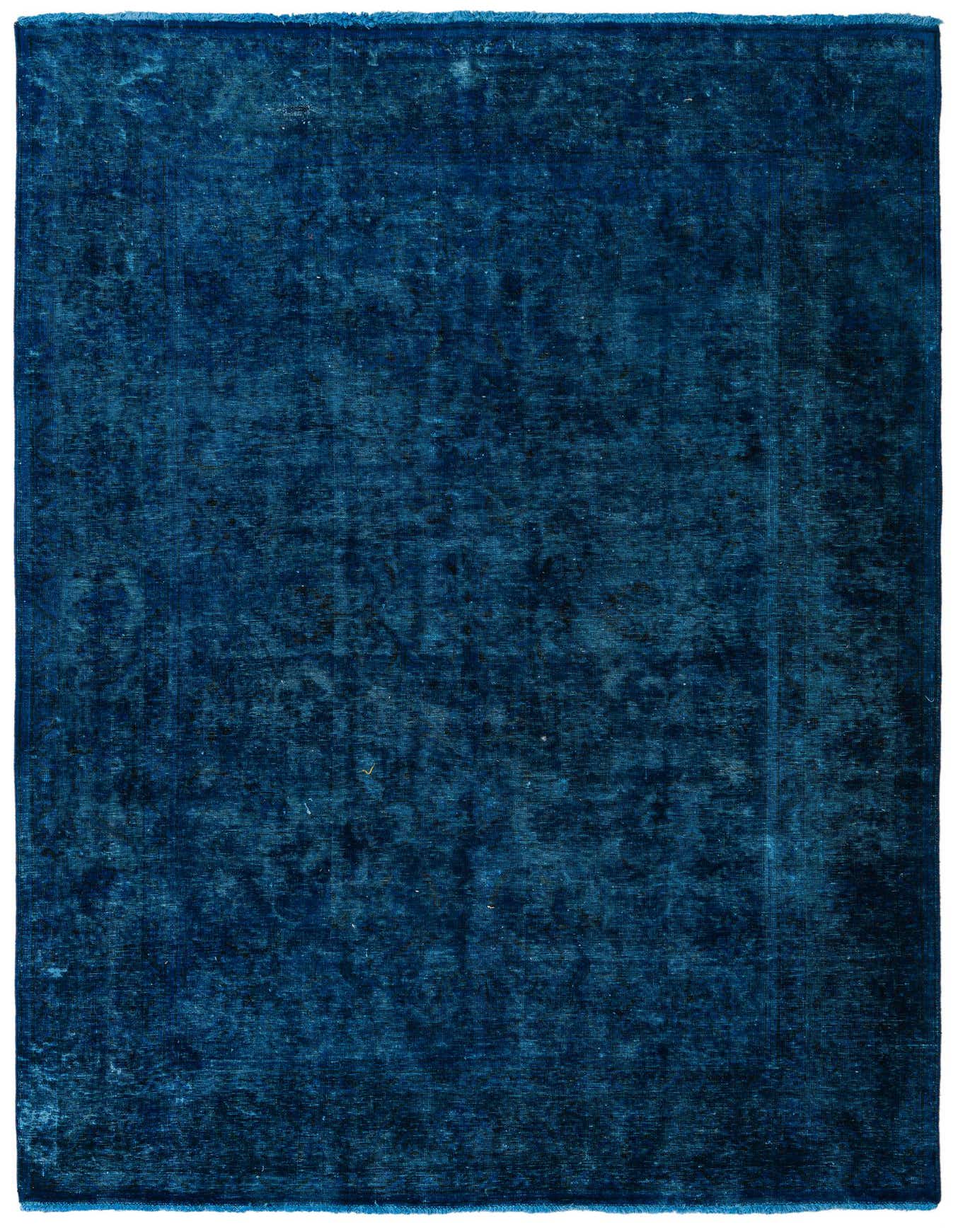 A 7x10 rectangular blue wool rug with a subtle, distressed Persian medallion pattern, suitable for a living room.