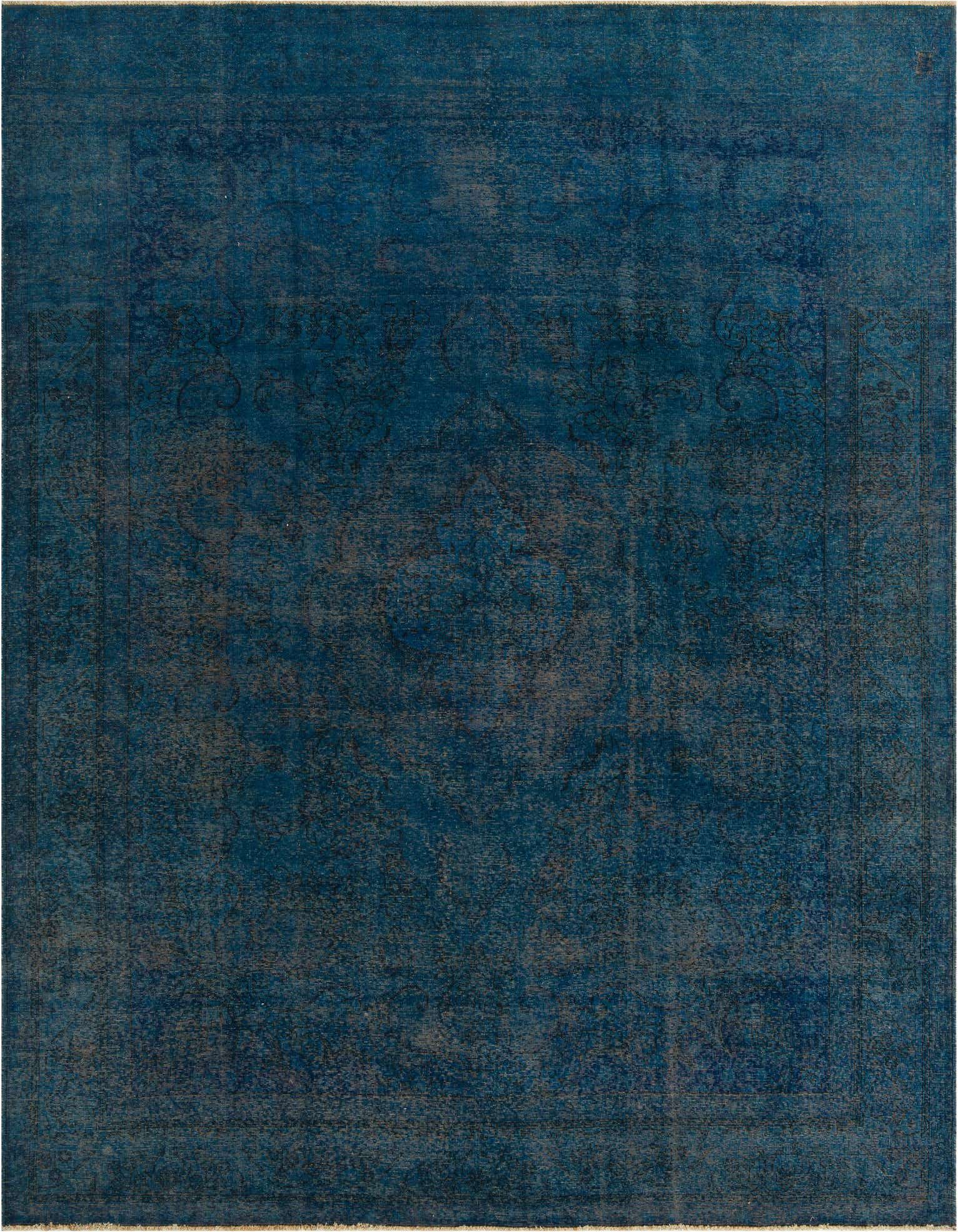A 10x13 rectangular blue wool rug featuring a distressed vintage Persian medallion pattern, ideal for a living room.