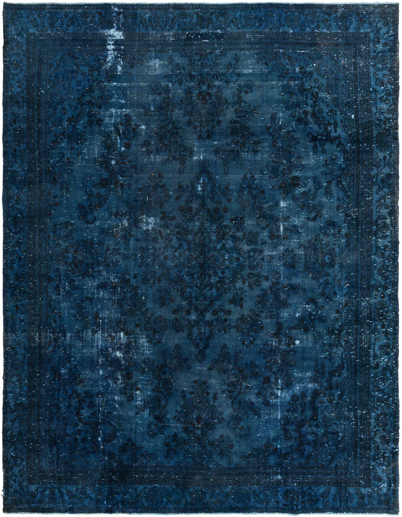 A 10x13 rectangular blue Persian-style wool rug with a faded vintage medallion pattern, suitable for a living room.