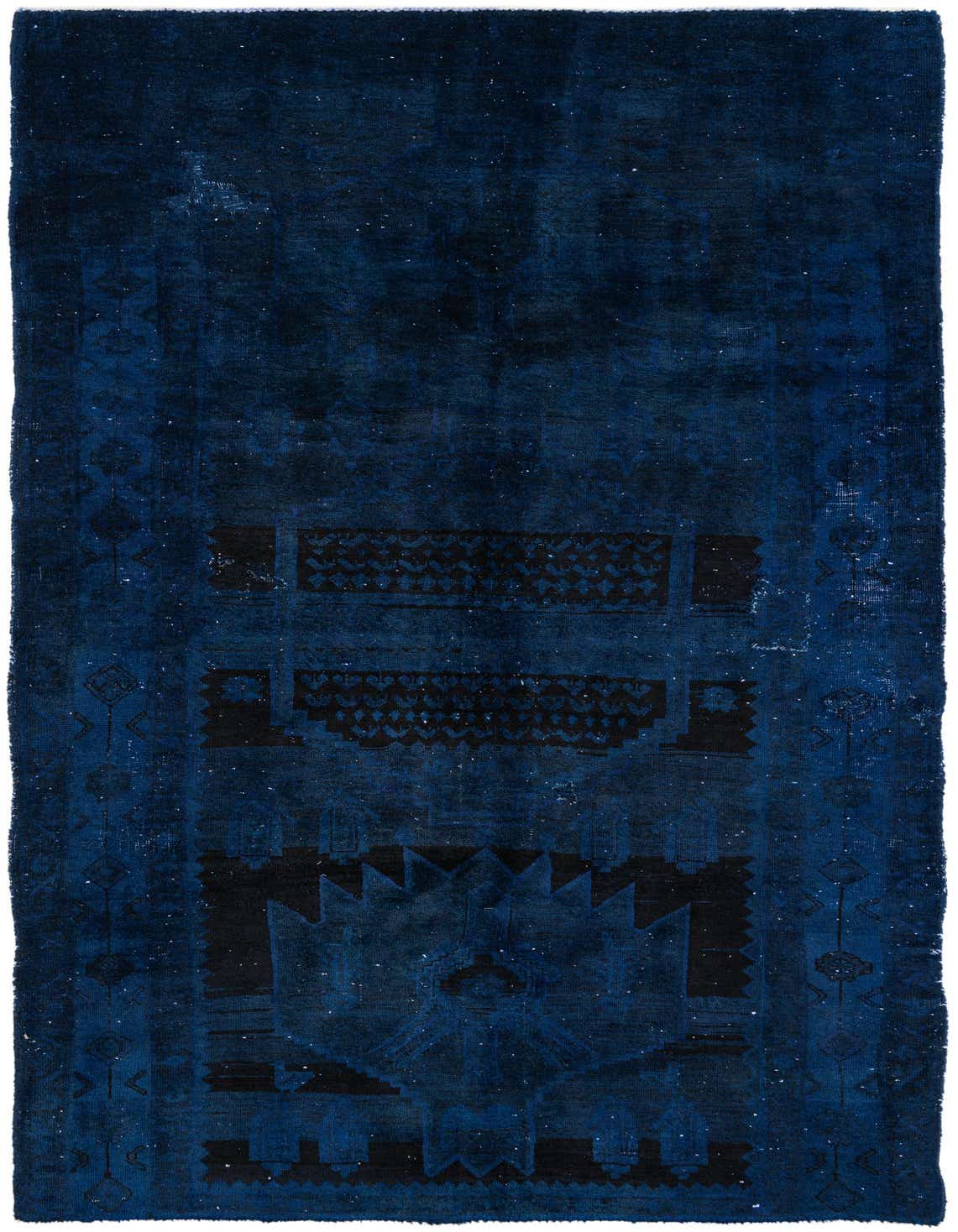 A 5x8 rectangular Ultra Vintage rug in deep blues with a distressed Persian-inspired pattern, handmade from wool.