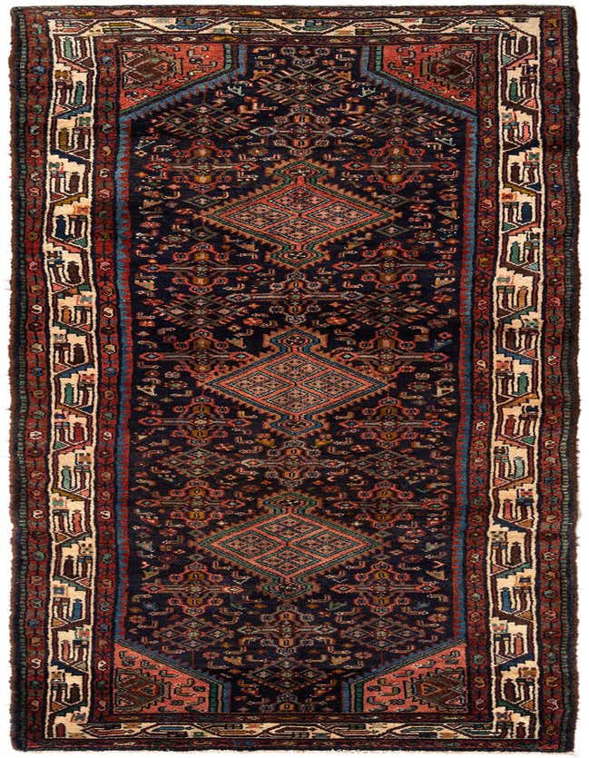 A handmade 11 ft runner rug with a dark blue background and intricate Persian tribal patterns in red, cream, and blue.