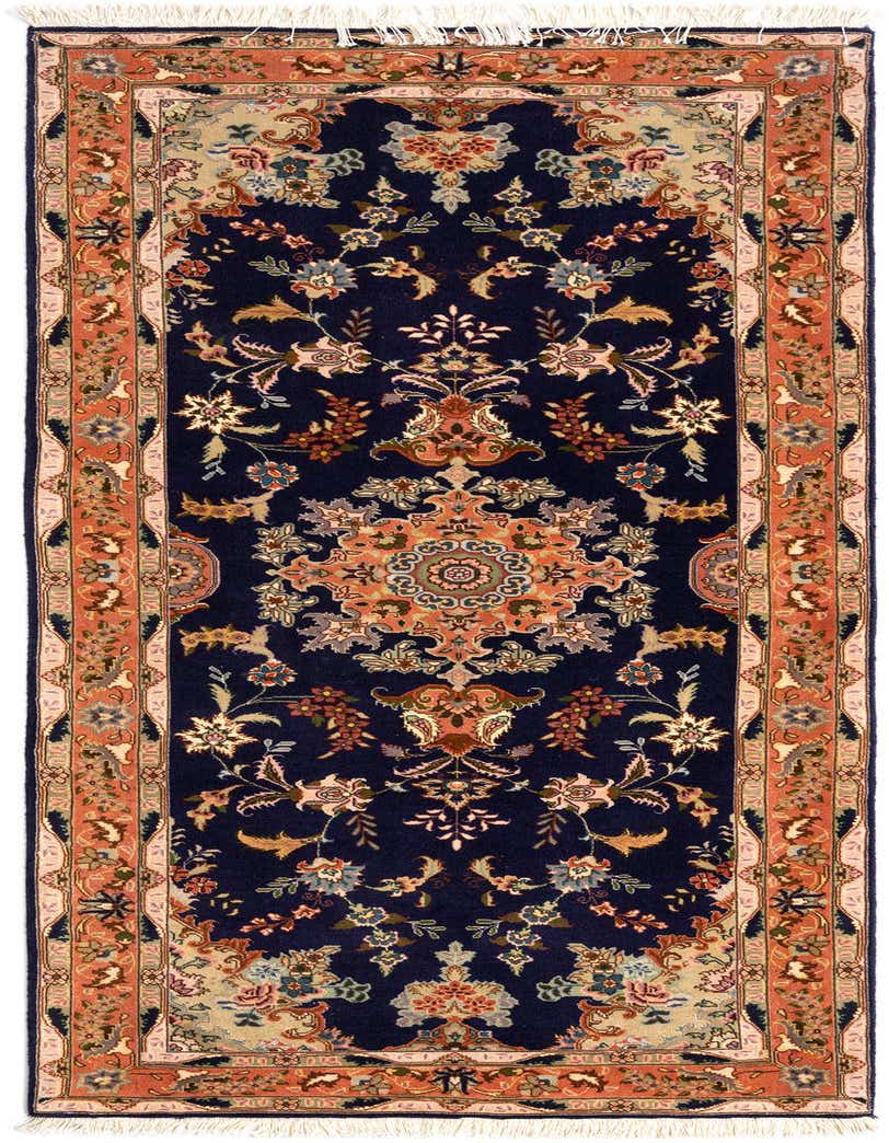 A handmade 7 ft runner rug in a traditional Persian style, featuring a deep blue field with an intricate floral medallion and a terracotta border.