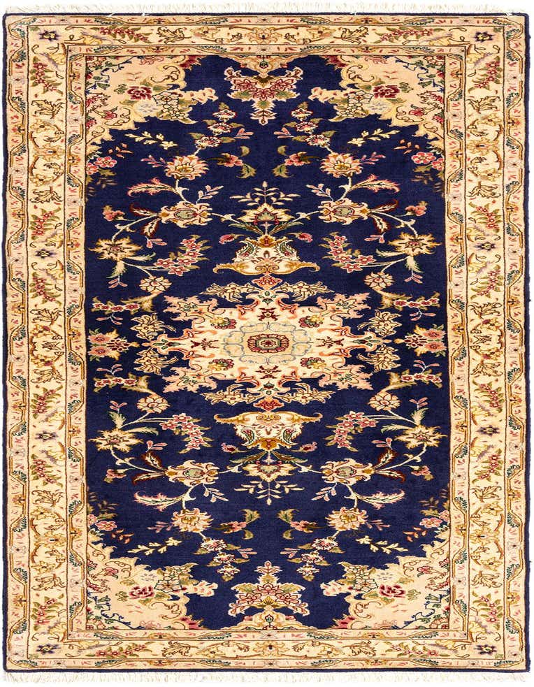 A 7 ft runner rug in a traditional Persian style, featuring an intricate floral pattern in blues and creams.