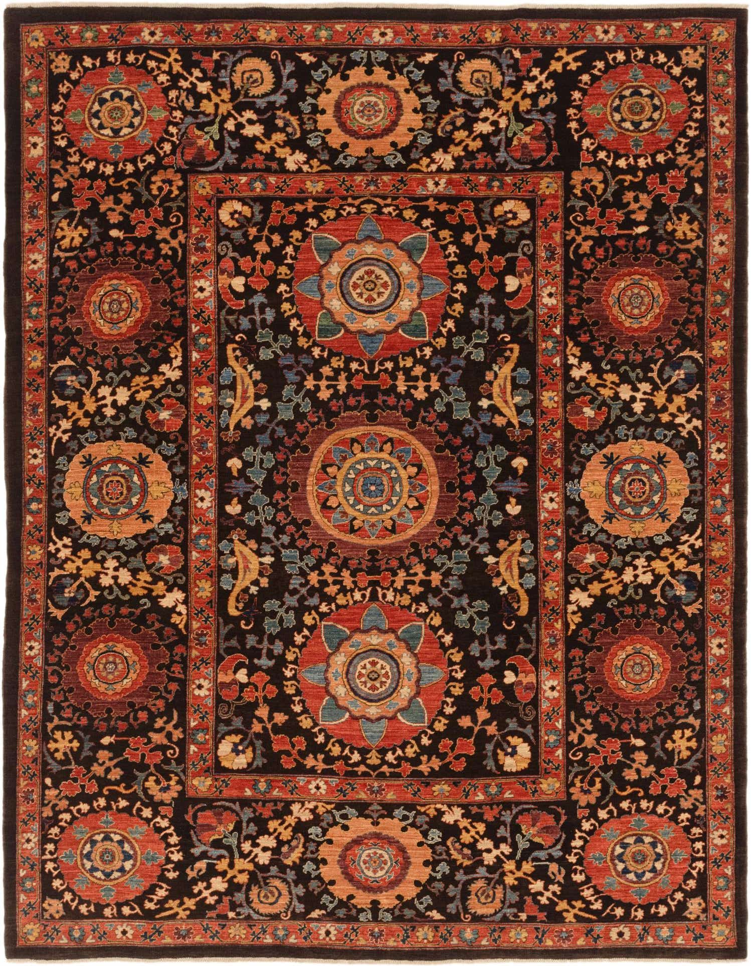 A 7x10 rectangular Ariana Ziegler rug featuring a traditional tribal pattern with large floral medallions in reds, oranges, and blues on a dark brown background, framed by a patterned border.