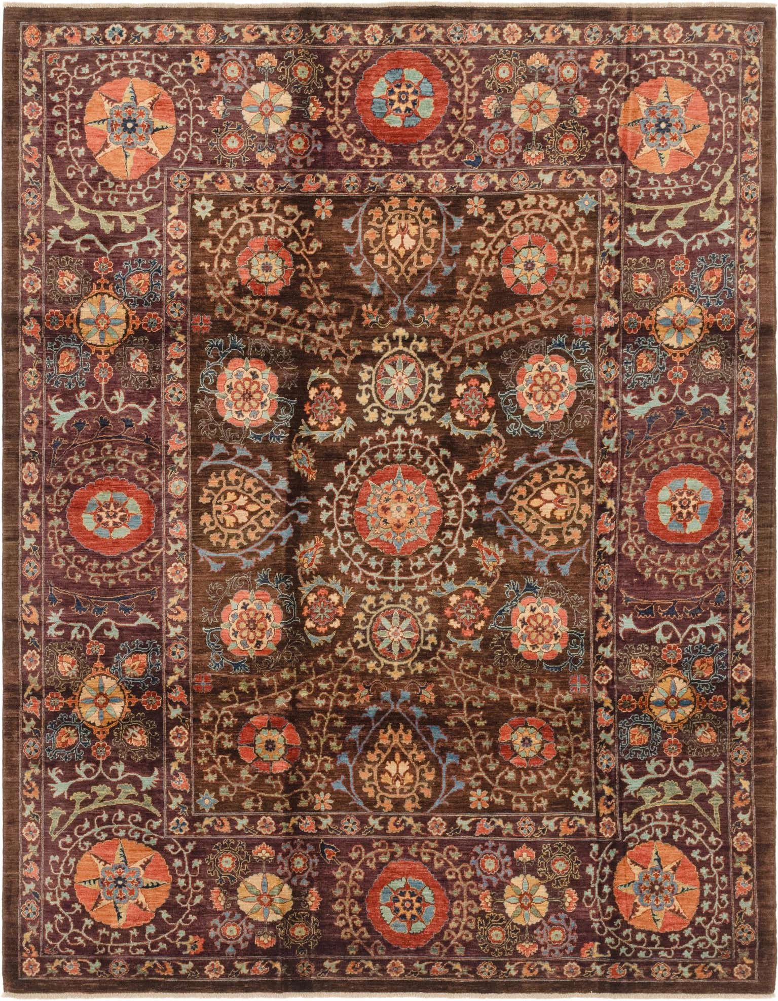 A 7x10 rectangular Ariana Ziegler rug featuring a traditional tribal pattern in rich browns, tans, and accent colors.