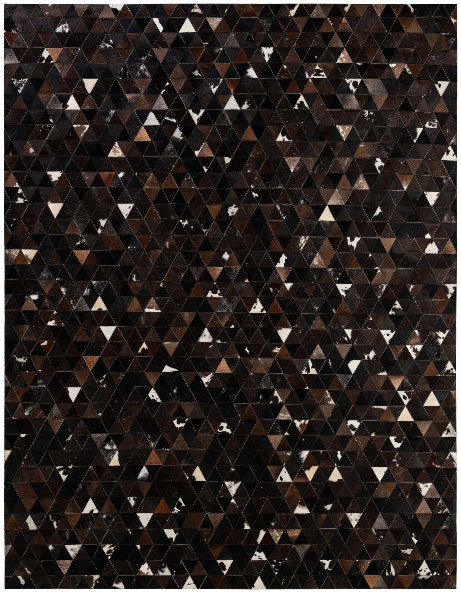 A rectangular 8x10 Cowhide Patchwork rug featuring a modern geometric pattern of brown, tan, black, and white triangular cowhide pieces.