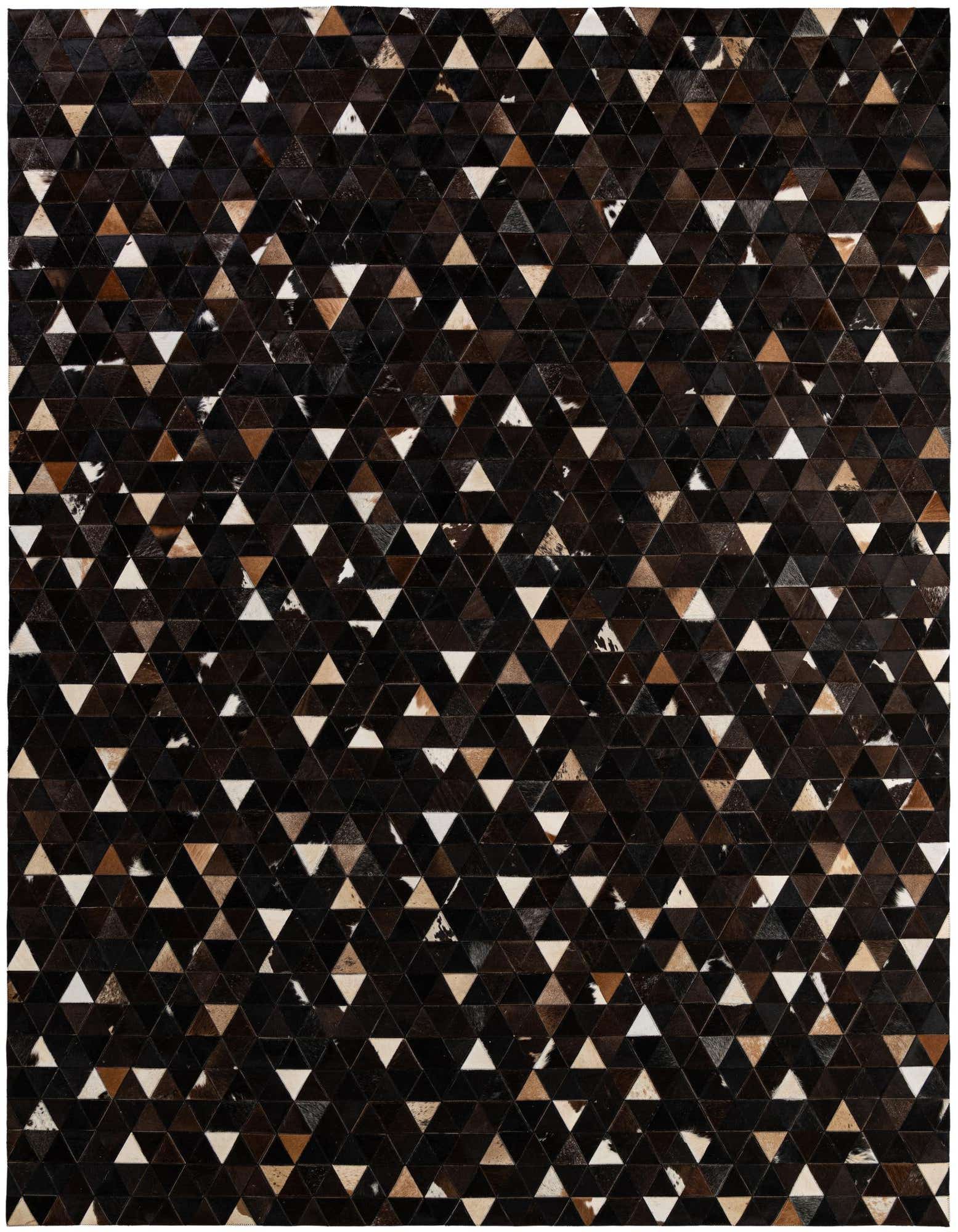 A rectangular 8x10 Cowhide Patchwork rug featuring a modern geometric pattern of brown, tan, and white triangular leather pieces.