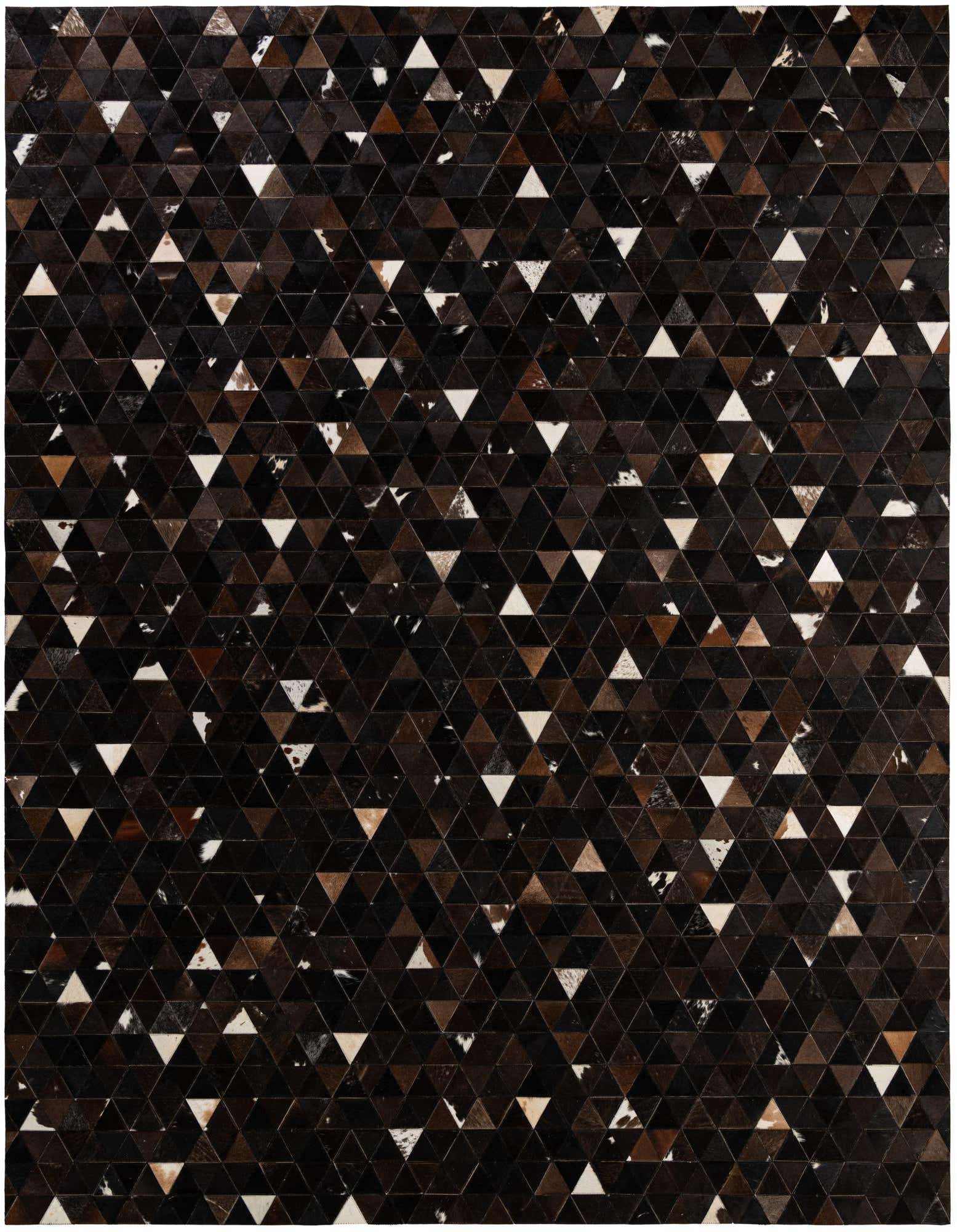 A rectangular 8x10 modern cowhide rug featuring a geometric patchwork of brown, tan, and white triangular pieces.