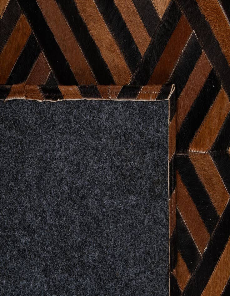 Detail image of  5' 1 x 7' 11 Cowhide - Patchwork Rug