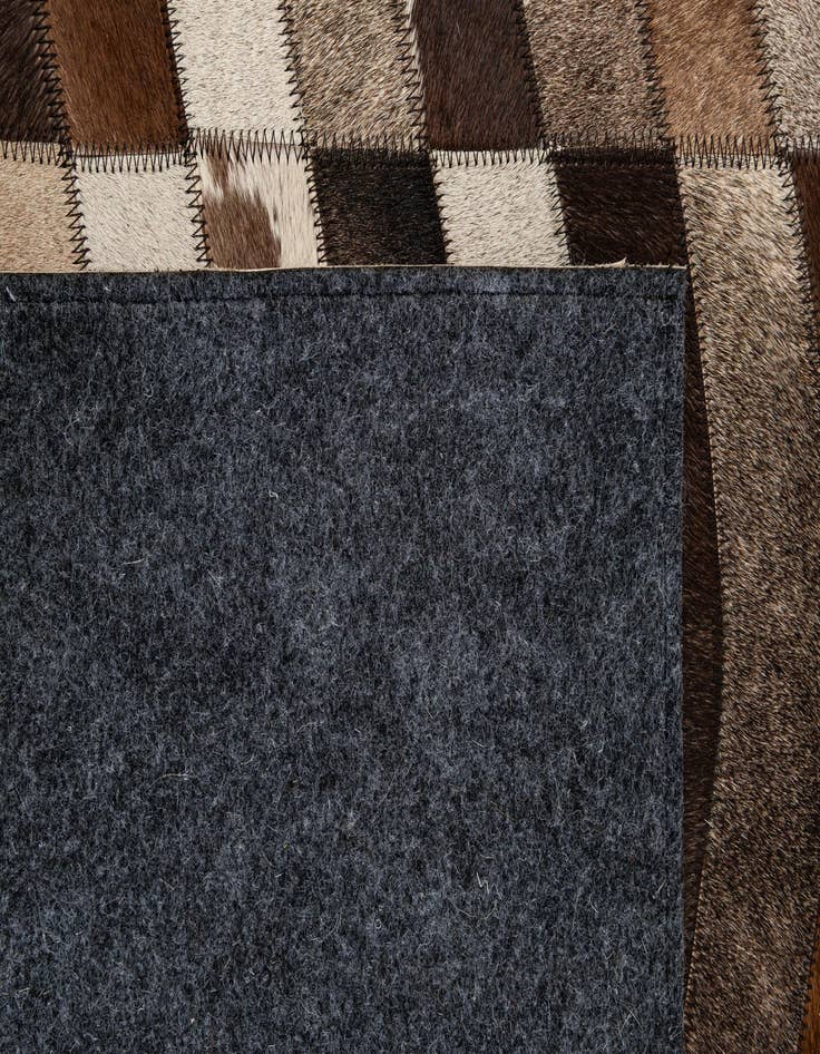Detail image of  5' 1 x 7' 10 Cowhide - Patchwork Rug