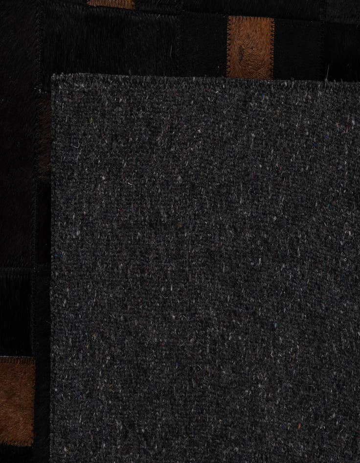 Detail image of  5' 1 x 8' 3 Cowhide - Patchwork Rug