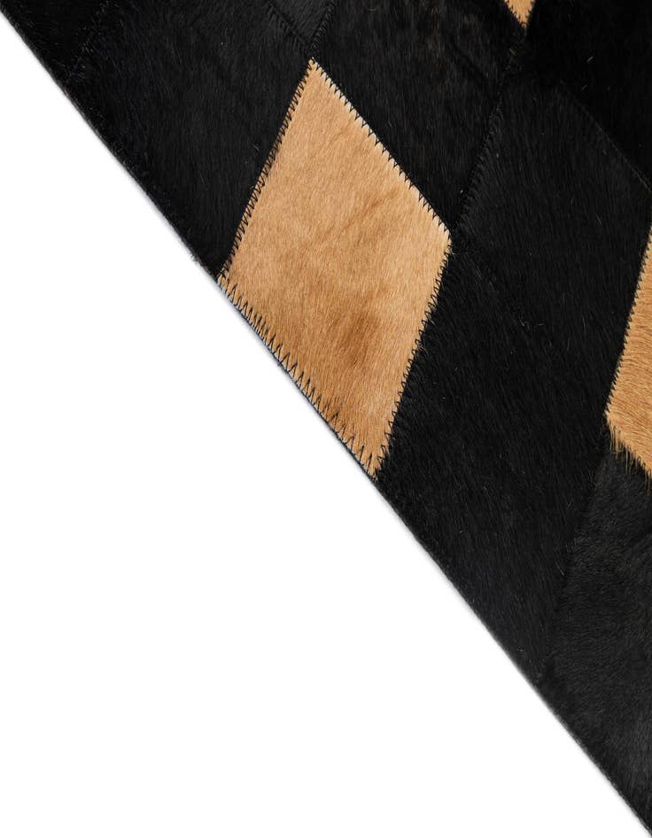 Detail image of  5' 1 x 7' 11 Cowhide - Patchwork Rug