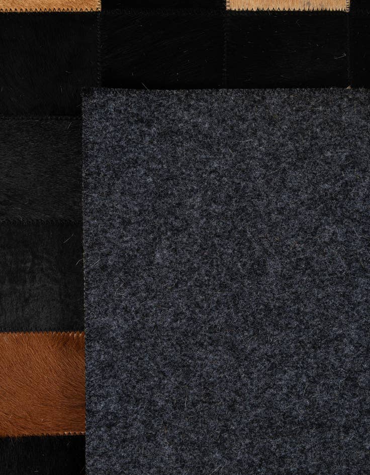 Detail image of  5' 1 x 7' 11 Cowhide - Patchwork Rug