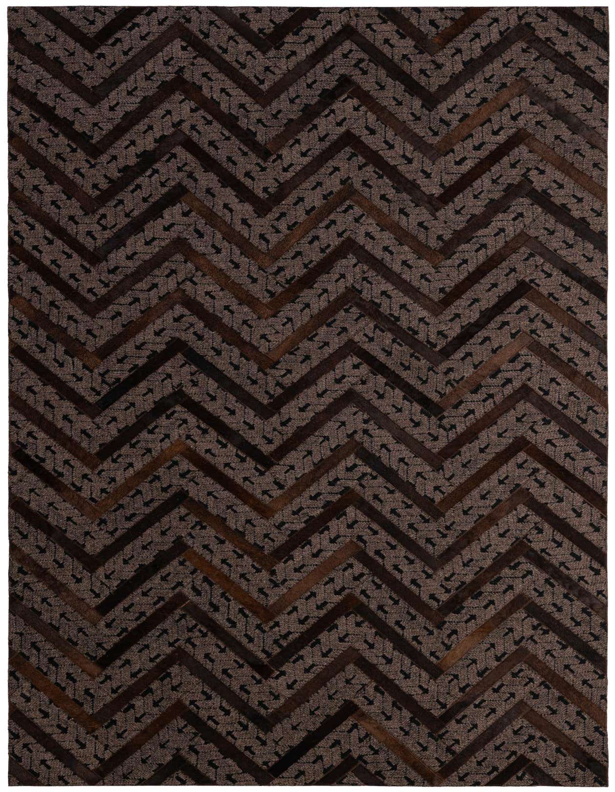 A 5x8 rectangular Cowhide & Leather rug featuring a modern, abstract chevron pattern in varying shades of brown and tan.