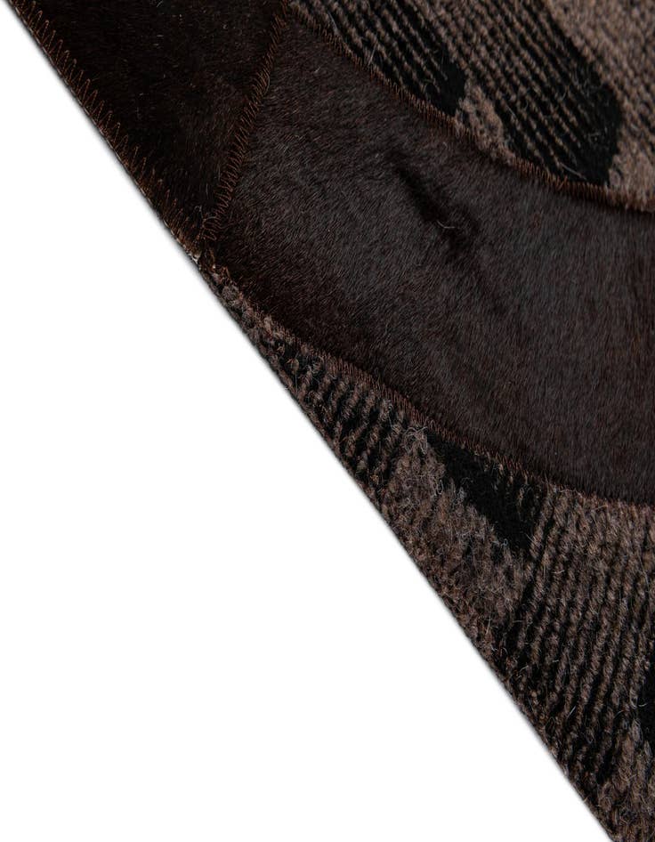 Detail image of  5' 1 x 7' 11 Cowhide - Patchwork Rug