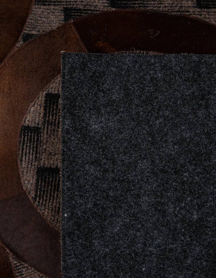 Detail image of  5' 1 x 7' 11 Cowhide - Patchwork Rug