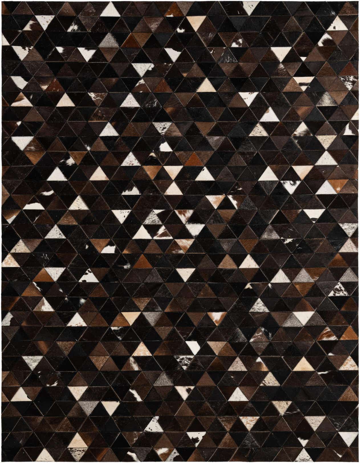 A 5x8 rectangular Cowhide Patchwork rug featuring a modern geometric pattern of brown, tan, and white triangular leather pieces.
