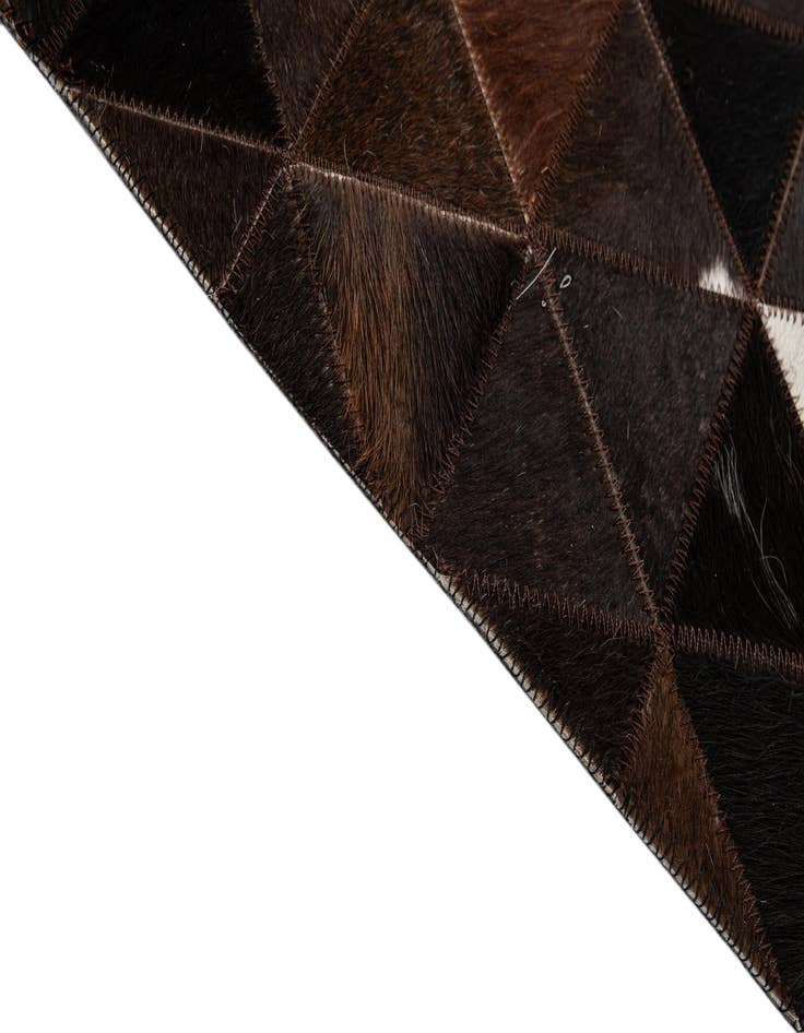 Detail image of  5' 1 x 7' 11 Cowhide - Patchwork Rug