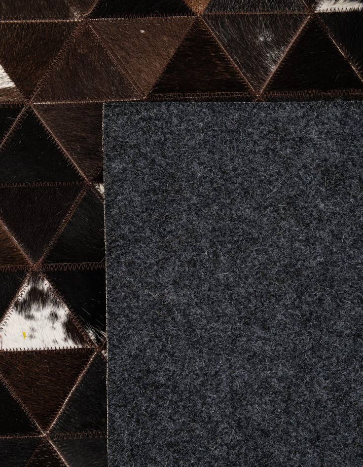 Detail image of  5' 1 x 7' 11 Cowhide - Patchwork Rug