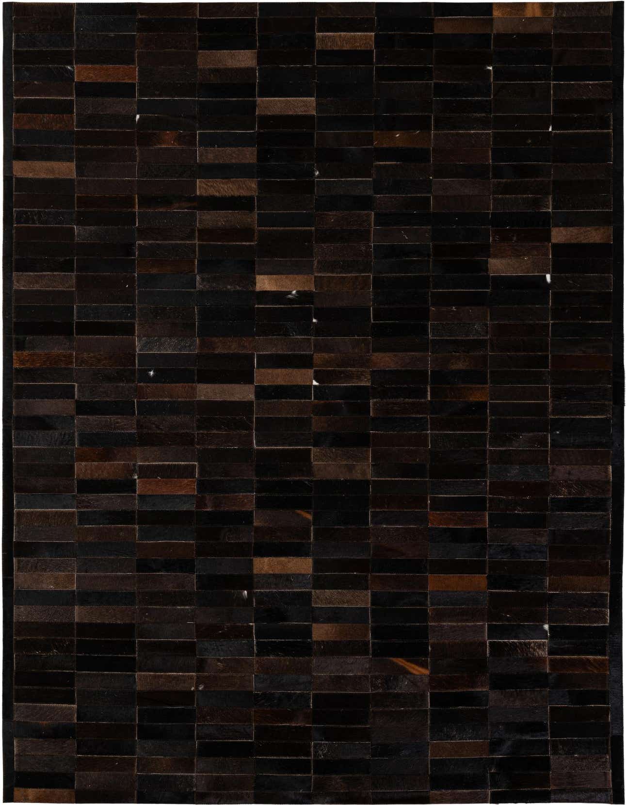 A rectangular 5x8 modern patchwork rug made from varying shades of brown and tan cowhide and leather strips.