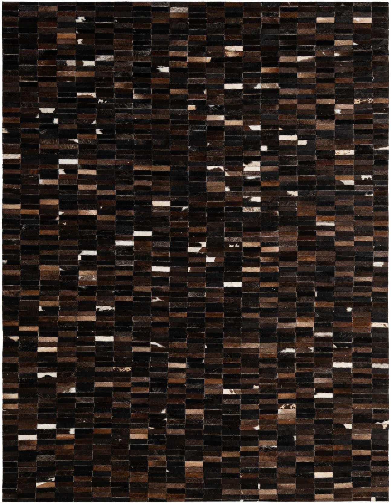 A 5x8 rectangular Cowhide Patchwork rug featuring a modern pattern of dark brown, tan, and white cowhide squares.