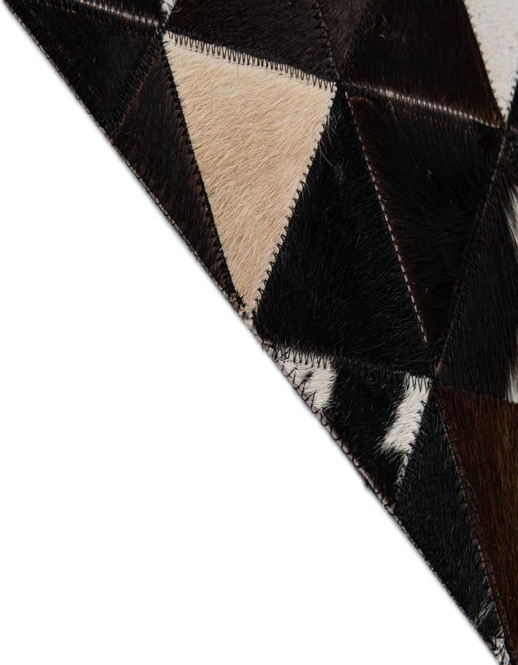 Detail image of  5' 1 x 7' 11 Cowhide - Patchwork Rug