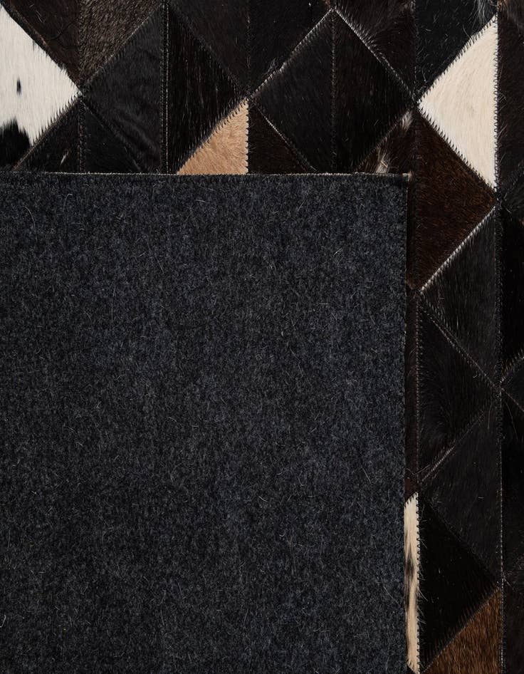 Detail image of  5' 1 x 7' 11 Cowhide - Patchwork Rug