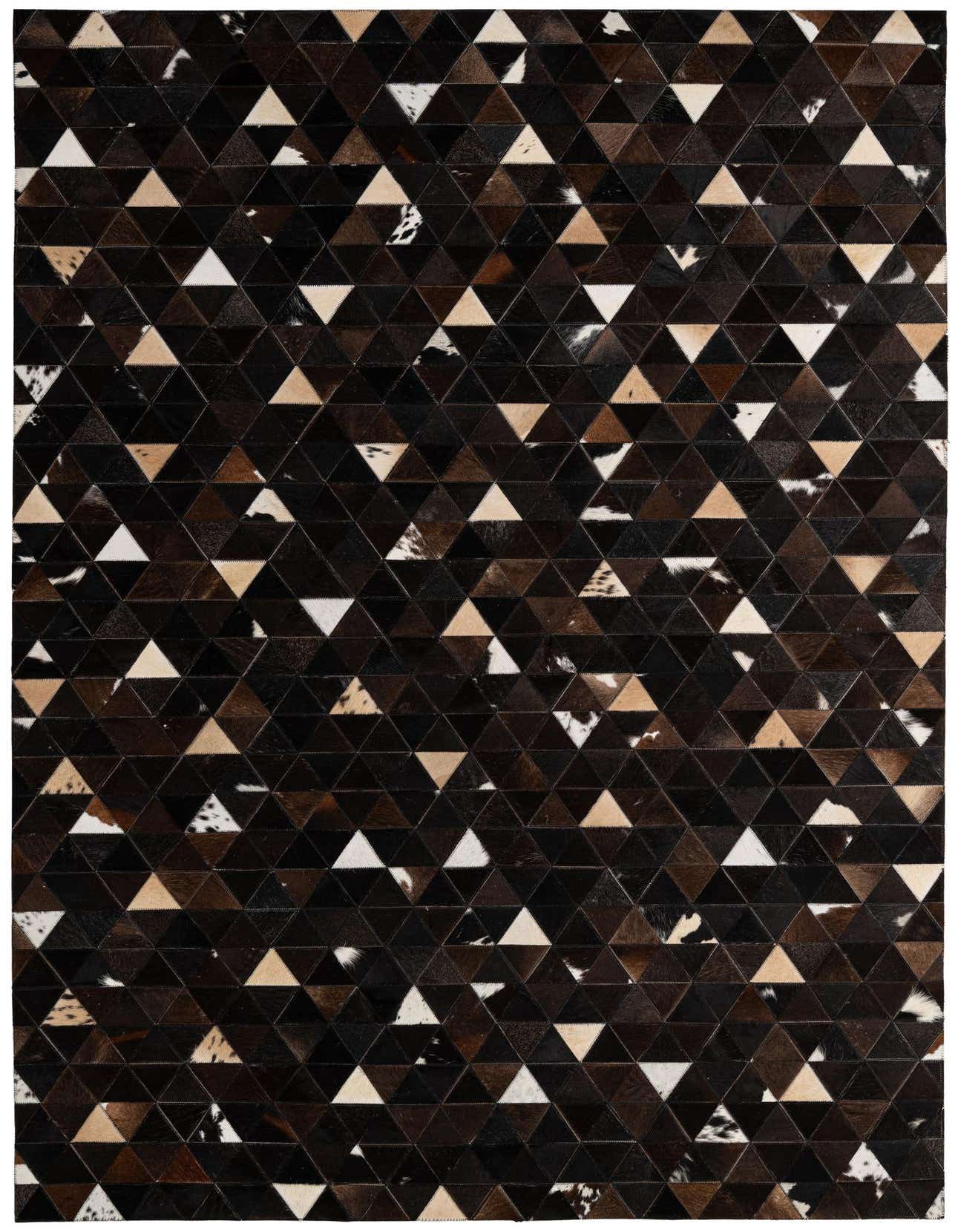 A 5x8 rectangular Cowhide - Patchwork rug featuring a modern geometric pattern of brown, tan, black, and white triangular cowhide patches.