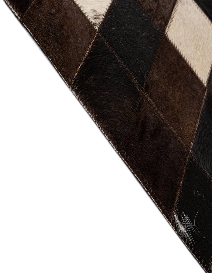 Detail image of  5' 1 x 7' 11 Cowhide - Patchwork Rug