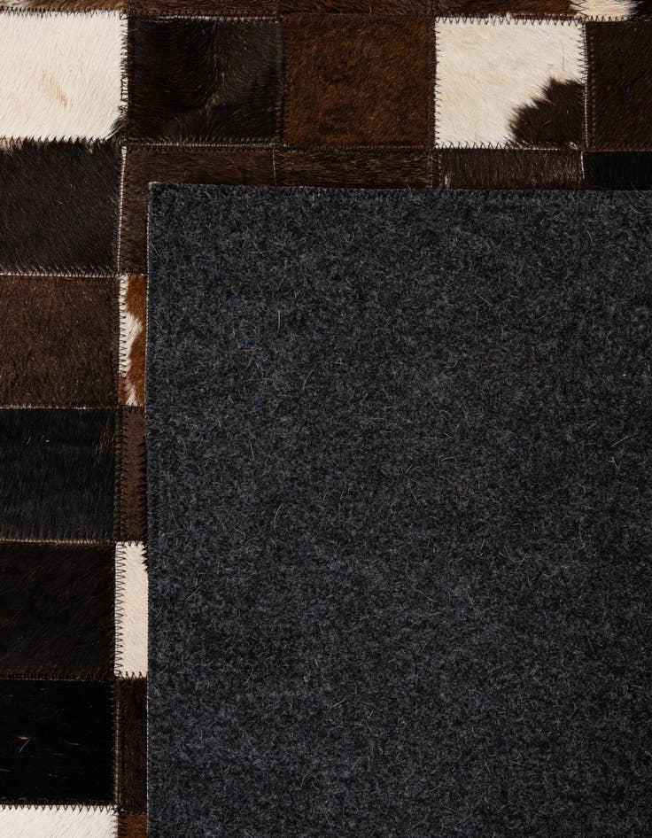 Detail image of  5' 1 x 7' 11 Cowhide - Patchwork Rug