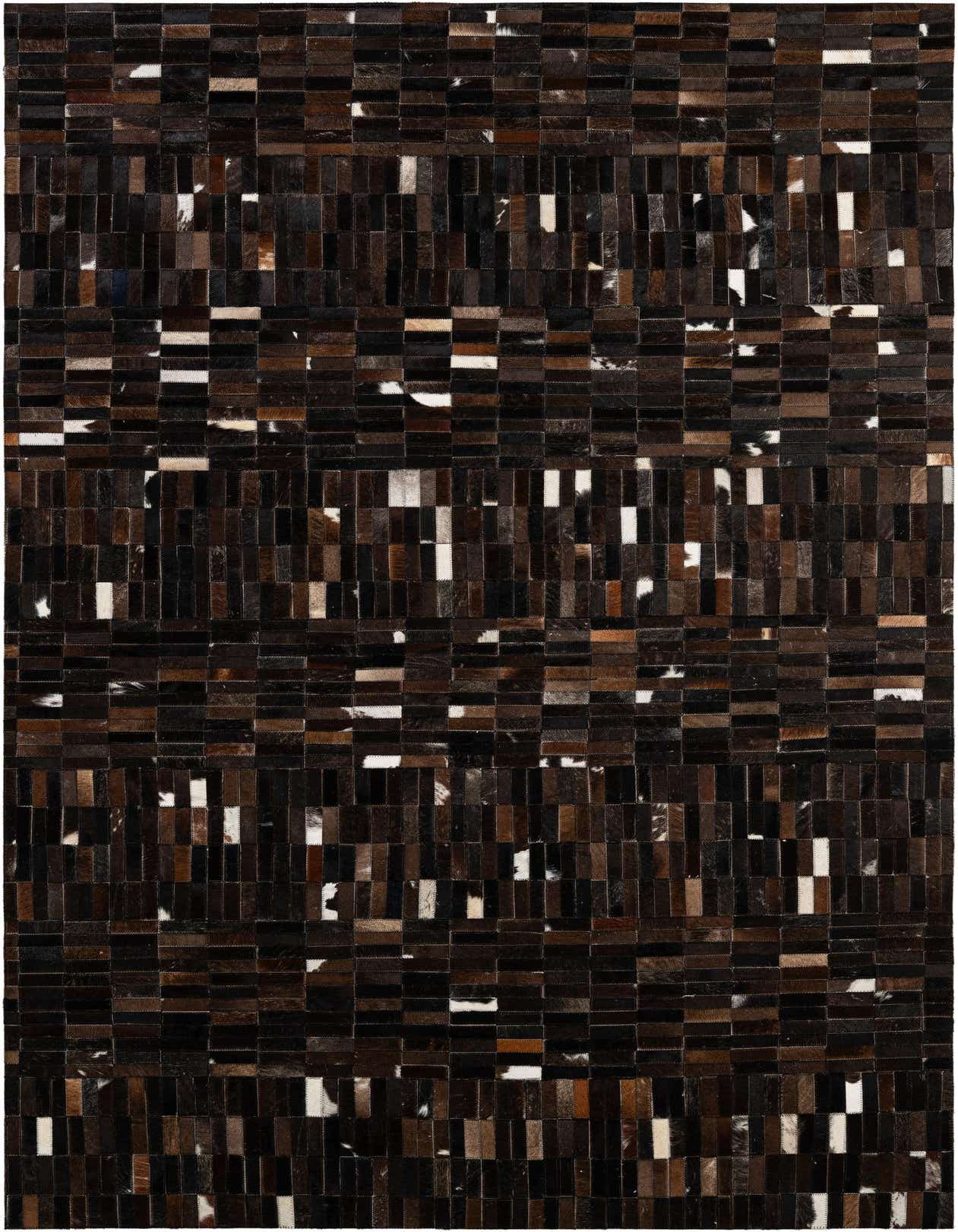 A rectangular 5x8 modern patchwork cowhide rug in varying shades of brown, tan, and black, with occasional white patches, suitable for a living room.
