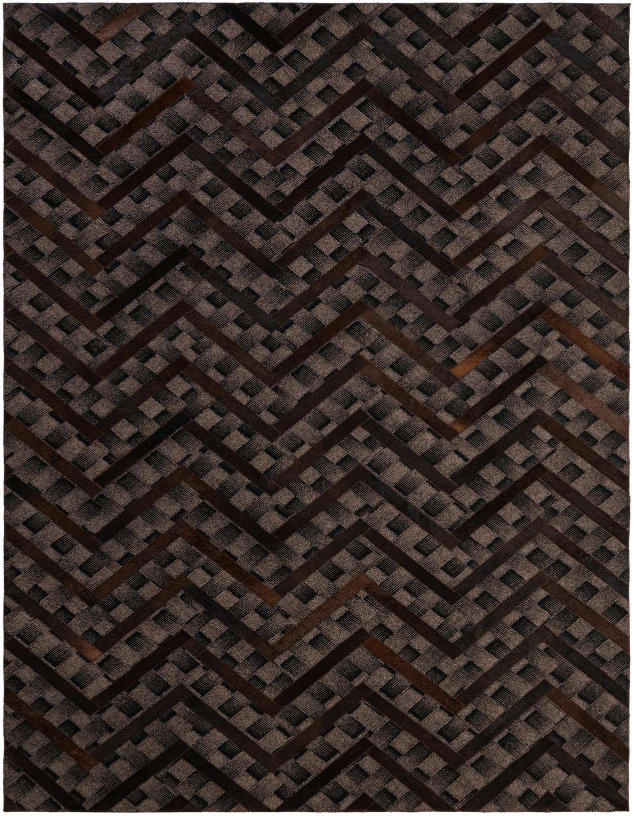 A 5x8 rectangular Cowhide - Patchwork rug featuring a modern chevron pattern in varying shades of brown and tan.