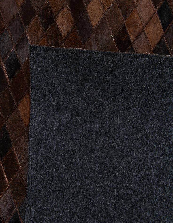 Detail image of  5' 11 x 8' 11 Cowhide Stocks Rug