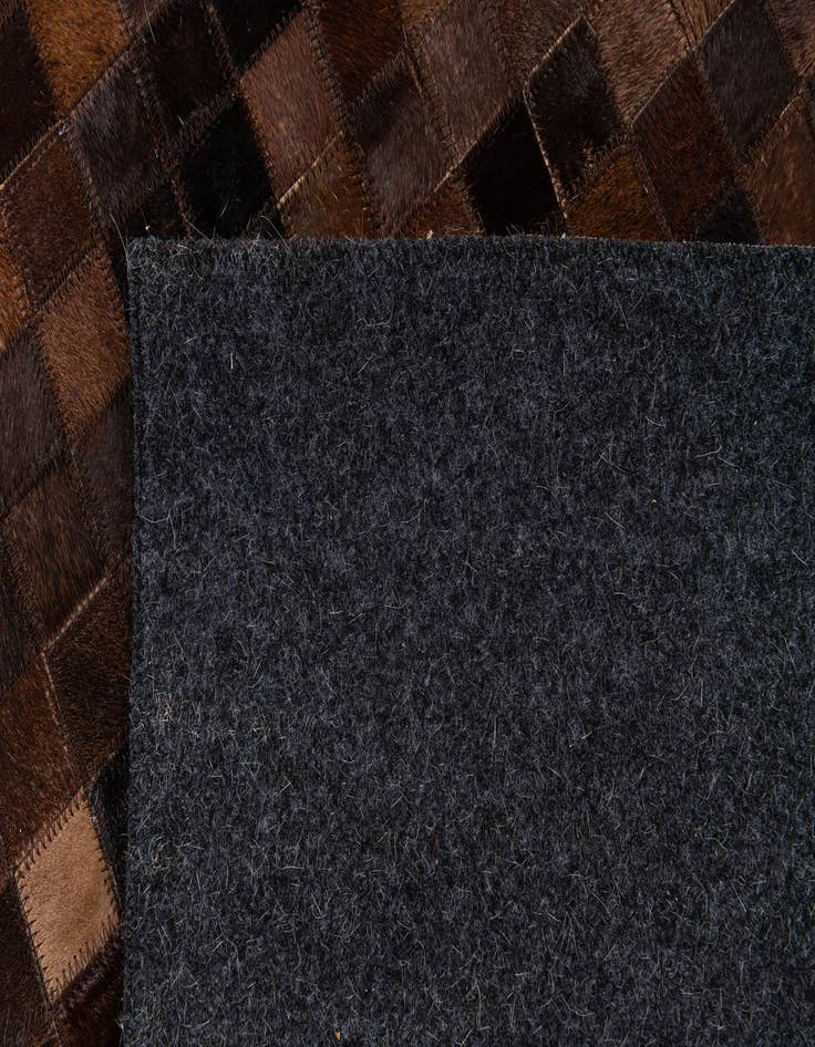 Detail image of  5' 11 x 8' 11 Cowhide Stocks Rug