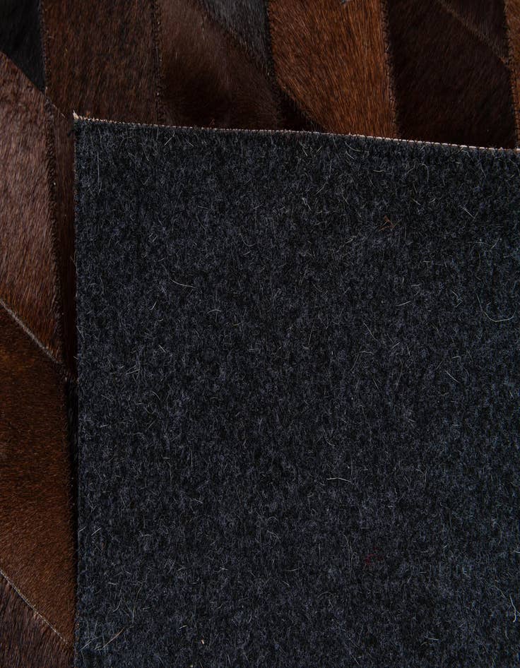 Detail image of  6' 6 x 9' 9 Cowhide Stocks Rug