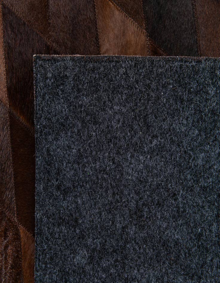 Detail image of  6' 6 x 9' 10 Cowhide Stocks Rug