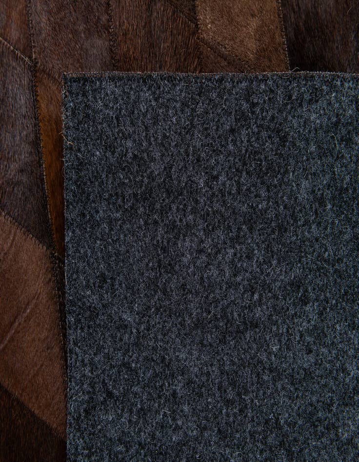 Detail image of  6' 7 x 9' 10 Cowhide Stocks Rug