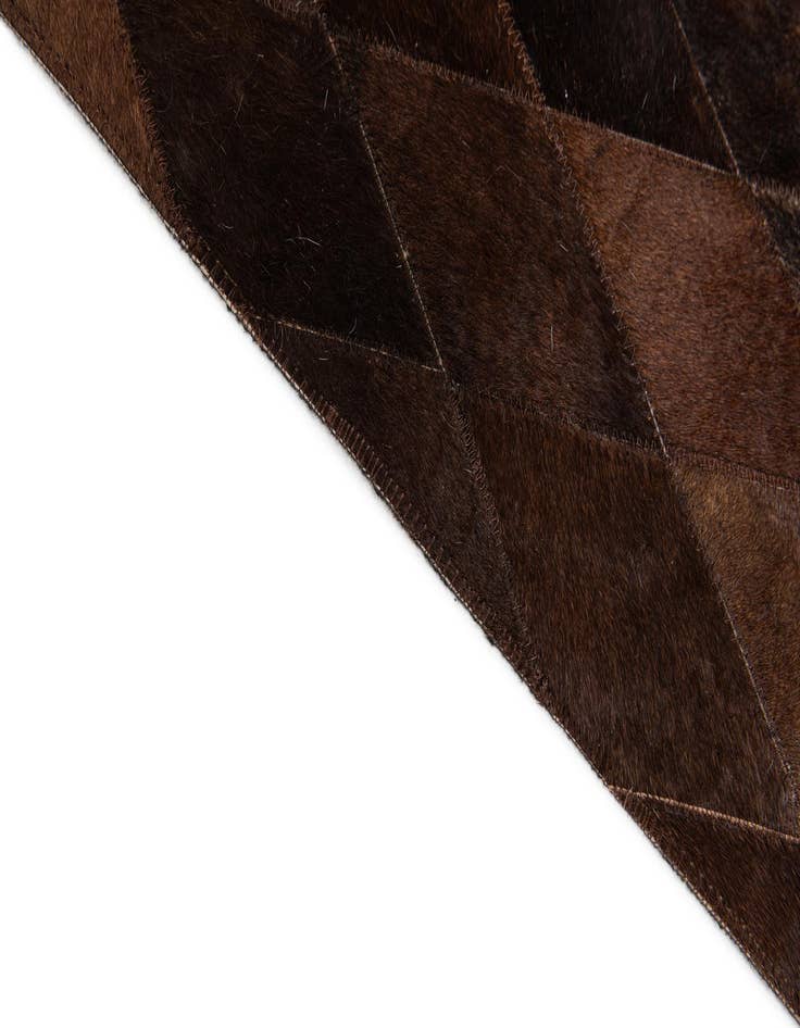 Detail image of  6' 7 x 9' 10 Cowhide Stocks Rug