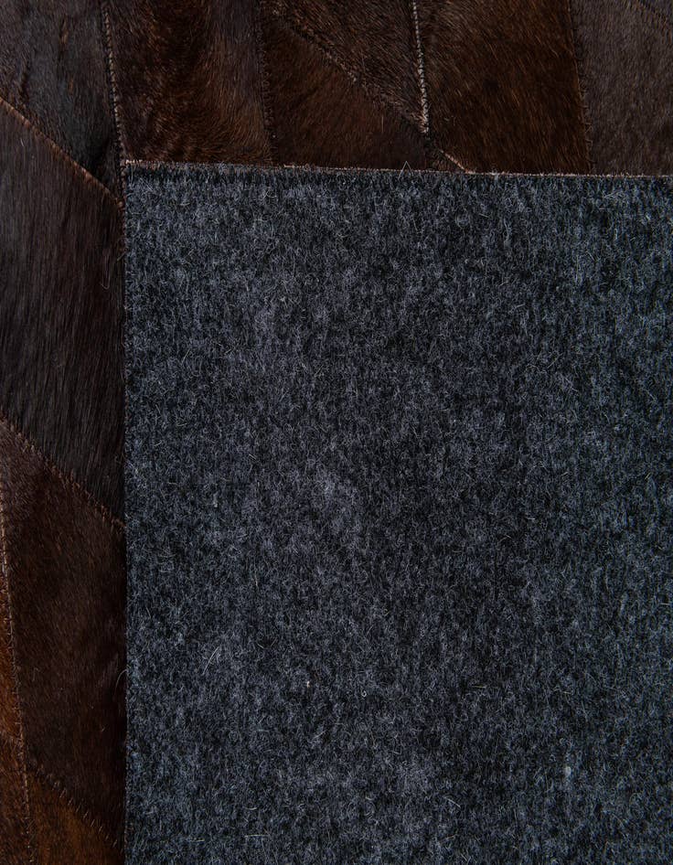 Detail image of  6' 7 x 9' 10 Cowhide Stocks Rug