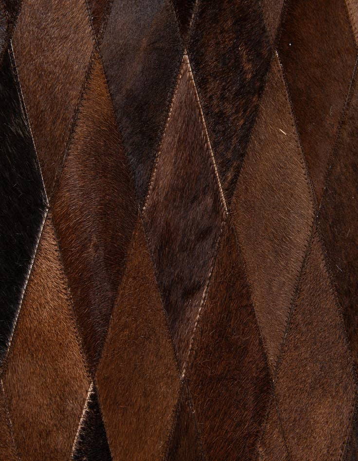 Detail image of  6' 7 x 9' 10 Cowhide Stocks Rug