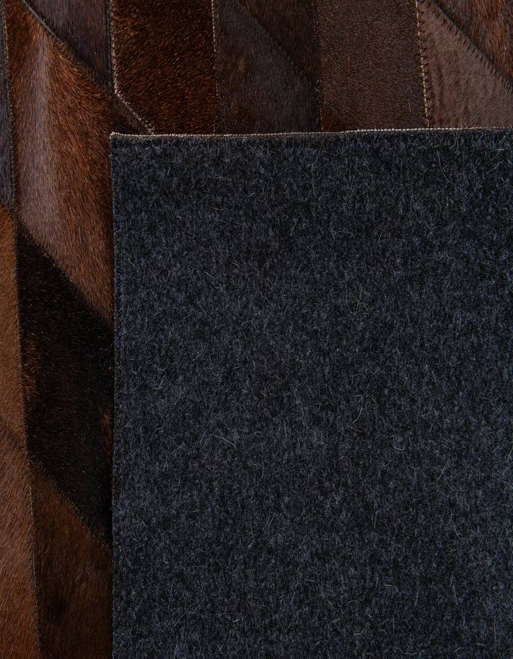 Detail image of  6' 7 x 9' 10 Cowhide Stocks Rug