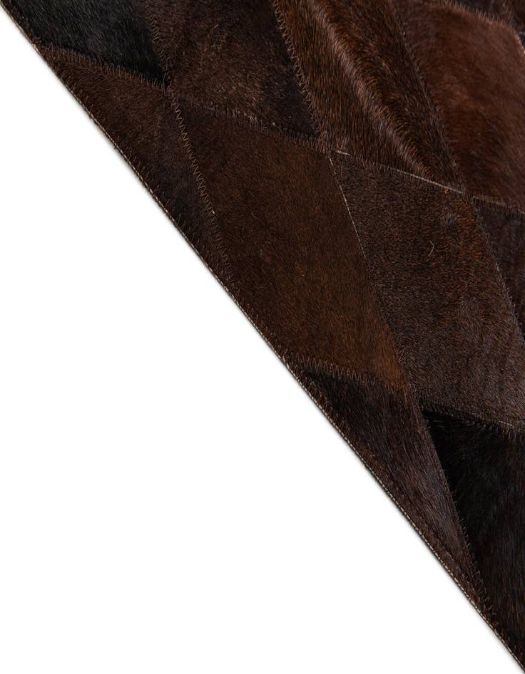 Detail image of  6' 6 x 9' 10 Cowhide Stocks Rug