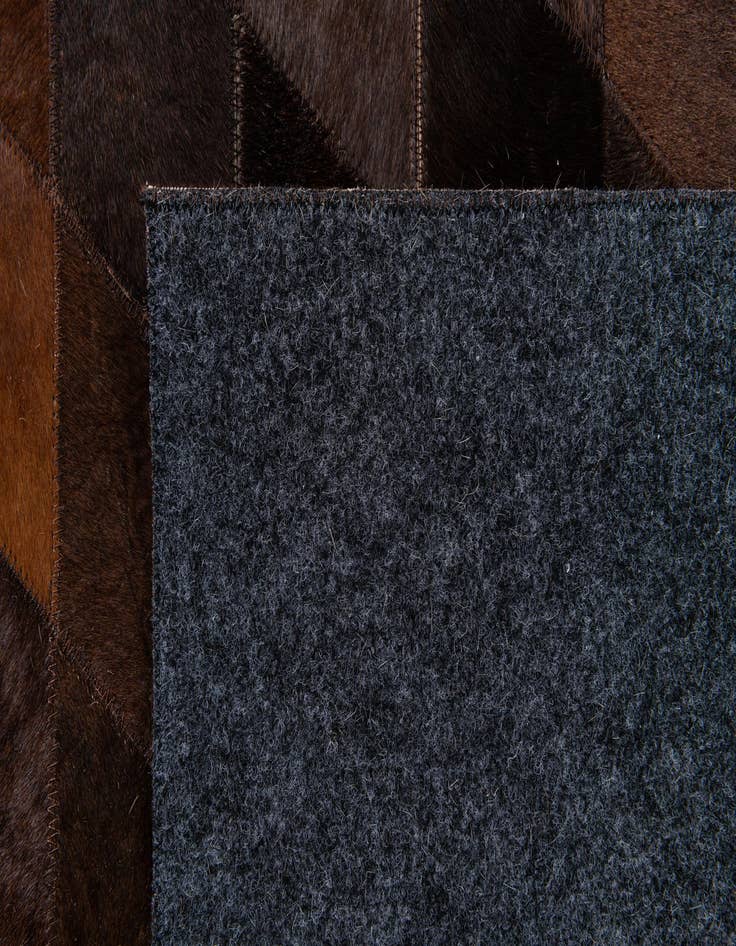 Detail image of  6' 6 x 9' 10 Cowhide Stocks Rug