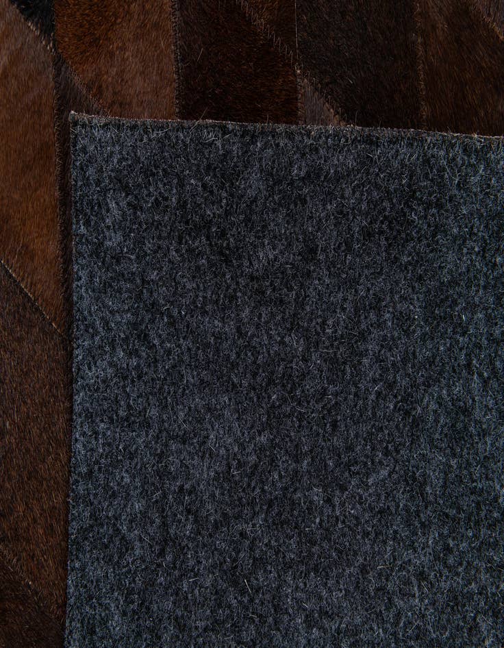 Detail image of  6' 6 x 9' 10 Cowhide Stocks Rug