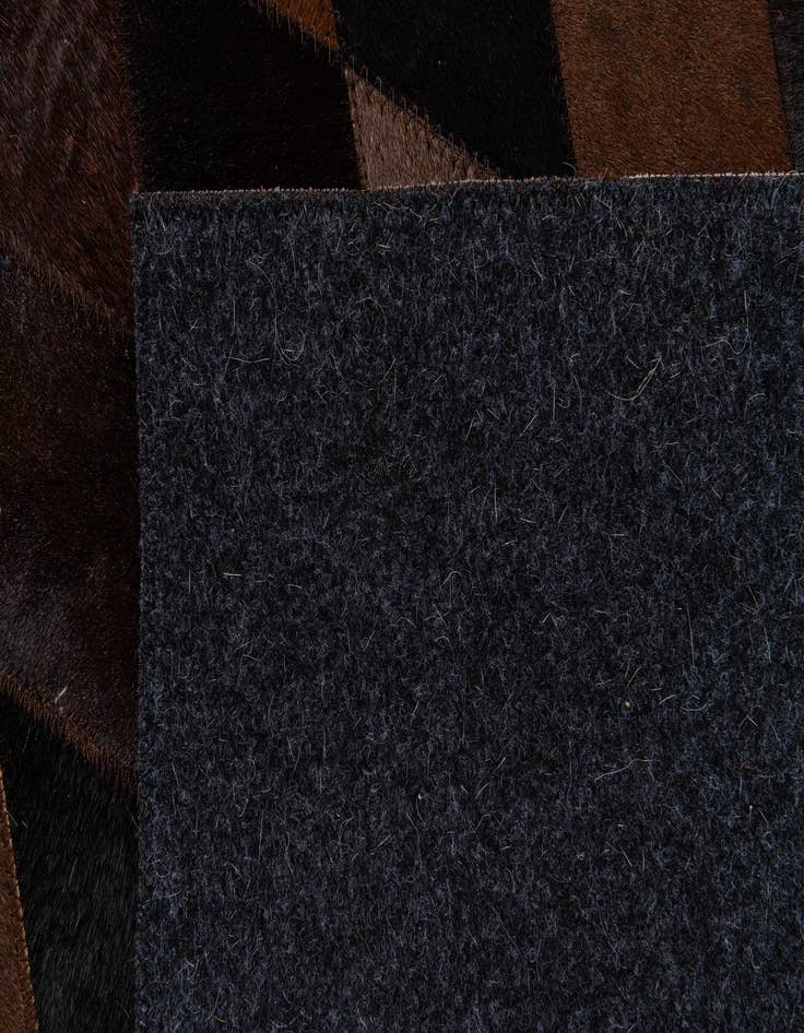 Detail image of  6' 6 x 9' 11 Cowhide Stocks Rug