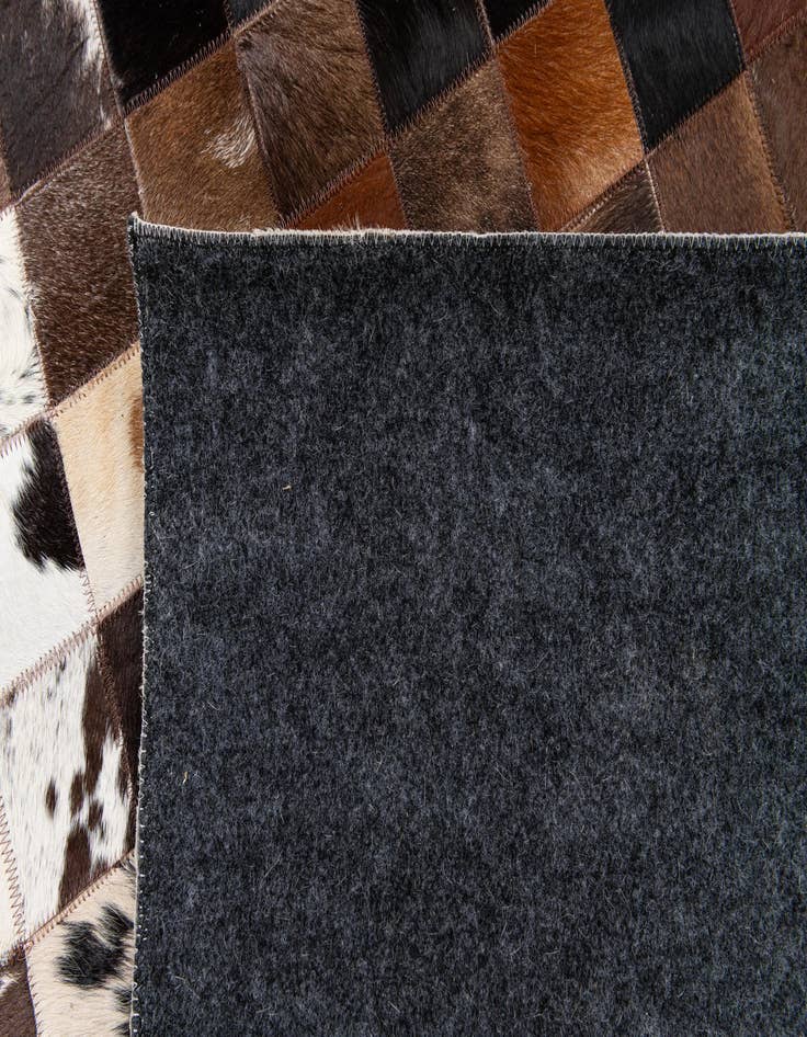 Detail image of  5' x 7' 11 Cowhide Stocks Rug