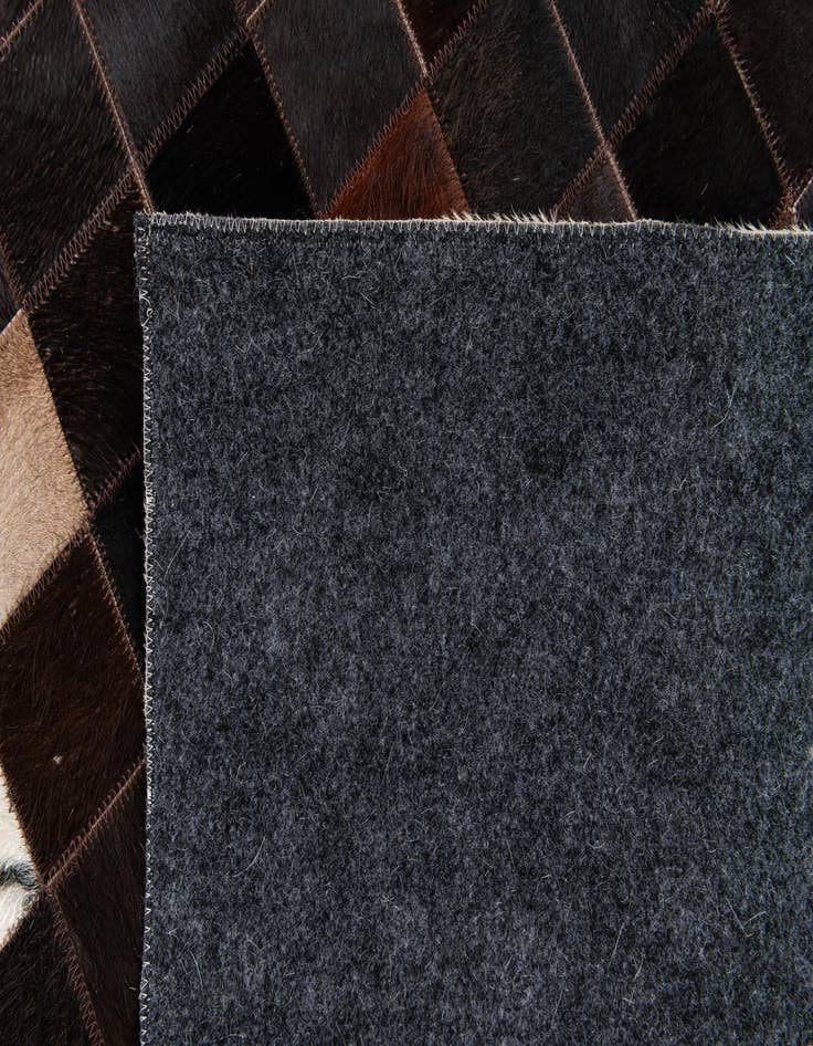 Detail image of  4' 11 x 7' 10 Cowhide Stocks Rug