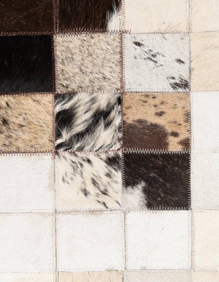 Detail image of  4' 11 x 7' 10 Cowhide Stocks Rug